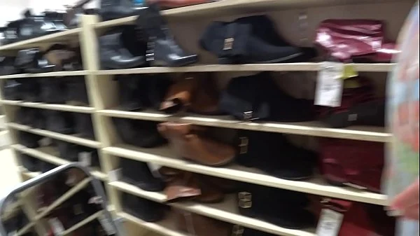 A voyeur with a hidden camera in a public place watches juicy booty. Foot fetish and peeping under a skirt in a shoe store.